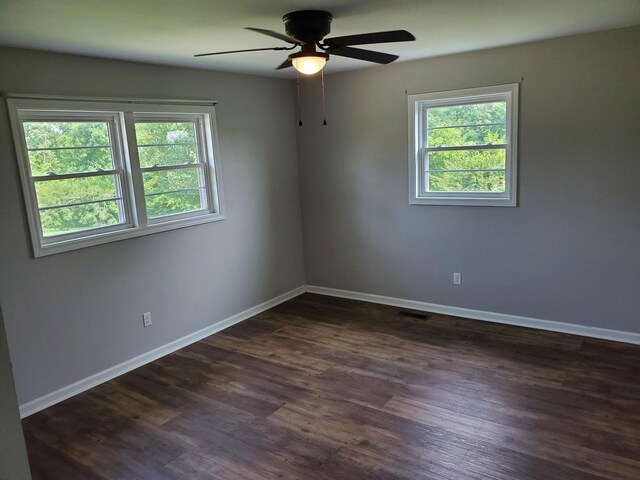 910 Hassell Dr, Waynesboro, TN 38485 - empty room featuring healthy amount of natural light, ceiling fan, dark wood-type flooring, and baseboards