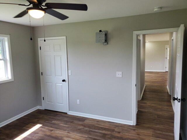 910 Hassell Dr, Waynesboro, TN 38485 - unfurnished room featuring a ceiling fan, dark wood-type flooring, and baseboards