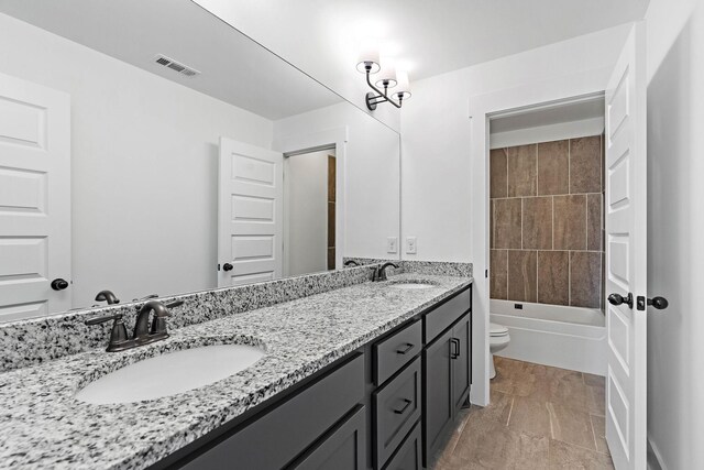 1105 Sunnymeade Dr, Nashville, TN 37216 - full bath with toilet, double vanity, and washtub / shower combination