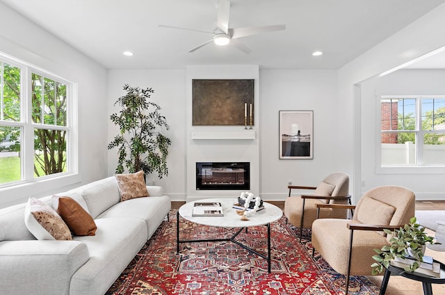 1105 Sunnymeade Dr, Nashville, TN 37216 - living area featuring a glass covered fireplace, ceiling fan, recessed lighting, baseboards, and wood finished floors