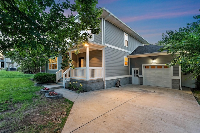 1105 Sunnymeade Dr, Nashville, TN 37216 - view of front facade featuring a porch, an attached garage, driveway, and a yard