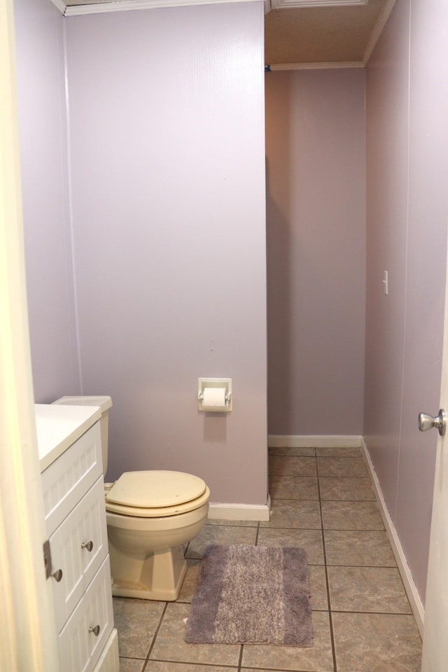 90 Laurel Ln, Paris, TN 38242 - half bathroom featuring toilet, vanity, crown molding, tile patterned floors, and baseboards