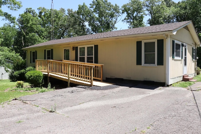 90 Laurel Ln, Paris, TN 38242 - single story home with a wooden deck and a shingled roof