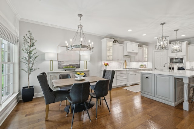 1018 Buddleia Ln, Franklin, TN 37067 - dining space featuring a chandelier, recessed lighting, plenty of natural light, crown molding, and dark wood-style flooring