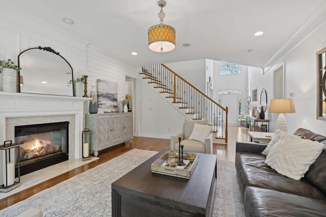 1018 Buddleia Ln, Franklin, TN 37067 - living room with stairway, wood finished floors, ornamental molding, a high end fireplace, and recessed lighting