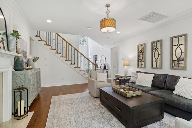 1018 Buddleia Ln, Franklin, TN 37067 - living room featuring wood finished floors, stairs, ornamental molding, recessed lighting, and baseboards