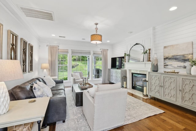 1018 Buddleia Ln, Franklin, TN 37067 - living room featuring crown molding, recessed lighting, wood finished floors, and a premium fireplace