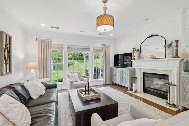 1018 Buddleia Ln, Franklin, TN 37067 - living room featuring wood finished floors, a high end fireplace, ornamental molding, and recessed lighting