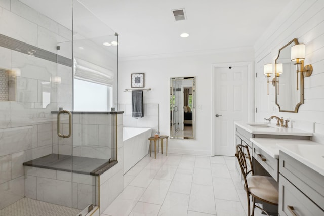 1018 Buddleia Ln, Franklin, TN 37067 - bathroom with ornamental molding, a tub, vanity, a stall shower, and marble look tile flooring