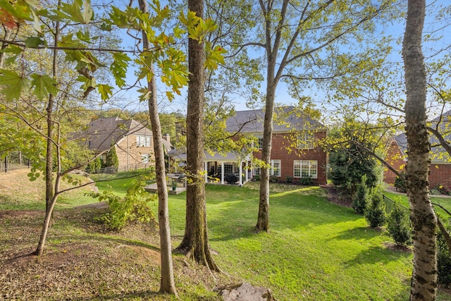 1018 Buddleia Ln, Franklin, TN 37067 - view of front of home featuring brick siding and a front lawn