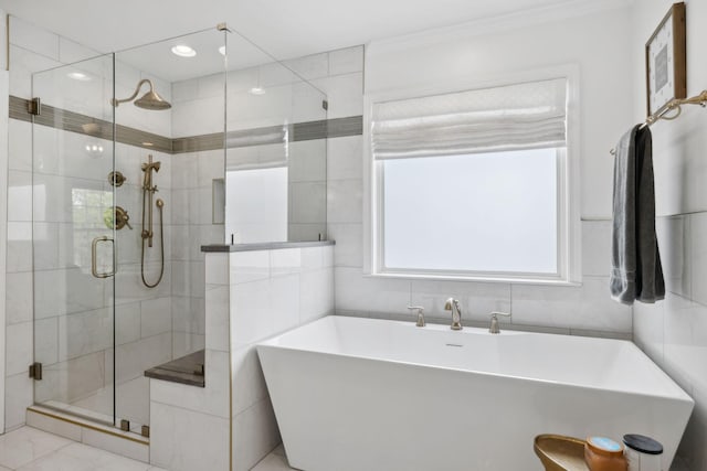 1018 Buddleia Ln, Franklin, TN 37067 - full bath with a shower stall, crown molding, a freestanding tub, and tile walls