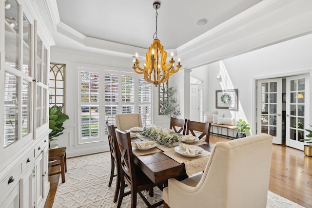 1018 Buddleia Ln, Franklin, TN 37067 - dining space featuring a chandelier, light wood finished floors, and crown molding