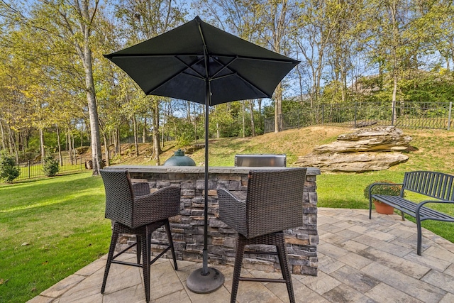 1018 Buddleia Ln, Franklin, TN 37067 - view of patio / terrace with an outdoor kitchen and view of wooded area