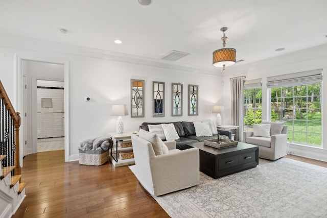 1018 Buddleia Ln, Franklin, TN 37067 - living area featuring stairway, hardwood / wood-style flooring, ornamental molding, and baseboards