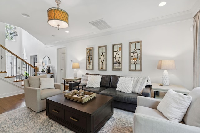 1018 Buddleia Ln, Franklin, TN 37067 - living area with light wood-style flooring, crown molding, stairway, recessed lighting, and baseboards