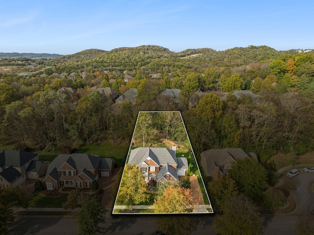 1018 Buddleia Ln, Franklin, TN 37067 - aerial view of residential area with property boundaries highlighted, a forest, and mountains