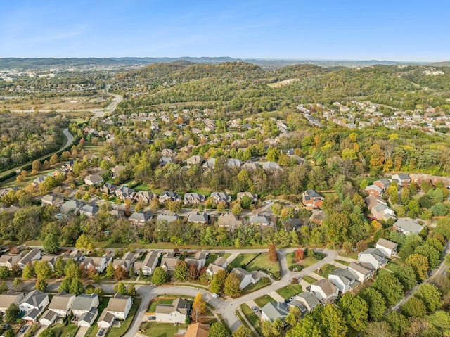 1018 Buddleia Ln, Franklin, TN 37067 - aerial view of property and surrounding area featuring nearby suburban area and a heavily wooded area