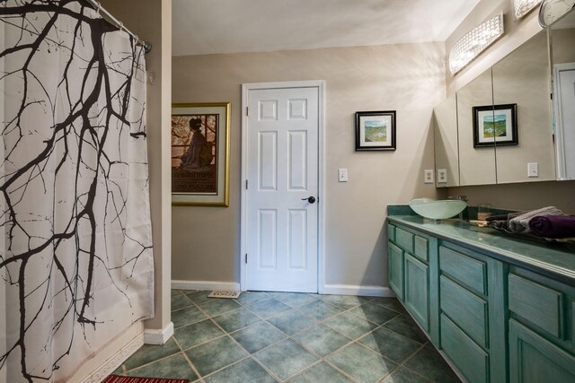 2290 Osburn Rd, Arrington, TN 37014 - bathroom featuring vanity, baseboards, a shower with shower curtain, and tile patterned flooring
