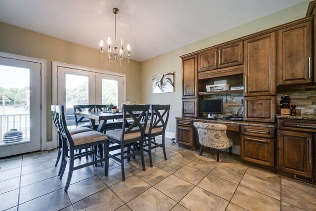 2290 Osburn Rd, Arrington, TN 37014 - dining room with a chandelier, light tile patterned floors, and vaulted ceiling