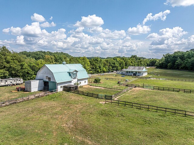 2290 Osburn Rd, Arrington, TN 37014 - view of yard featuring a rural view, an outbuilding, a barn, a detached garage, and a wooded view