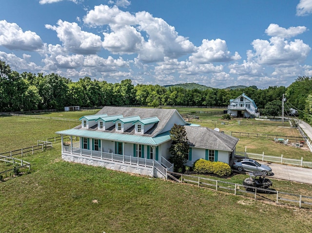 2290 Osburn Rd, Arrington, TN 37014 - farmhouse-style home featuring covered porch, metal roof, a rural view, and driveway