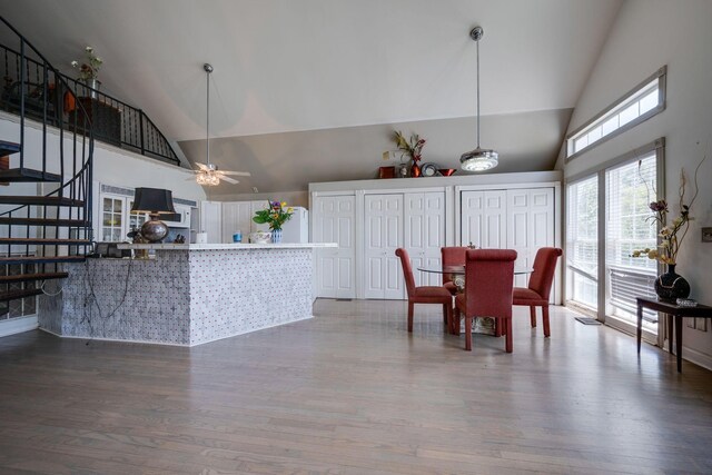 2290 Osburn Rd, Arrington, TN 37014 - dining space with high vaulted ceiling, wood finished floors, ceiling fan, and stairway