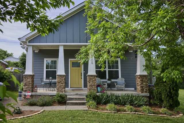1108 Jennings St, Nashville, TN 37208 - craftsman-style home with a porch, board and batten siding, and stone siding