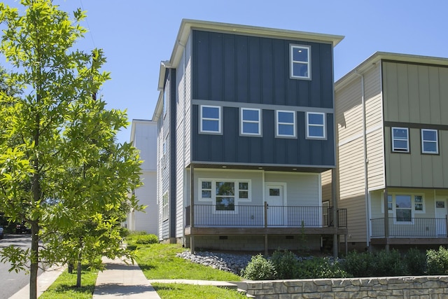 1137 Lawrence Ave Unit 1, Madison, TN 37115 - rear view of house with board and batten siding and covered porch