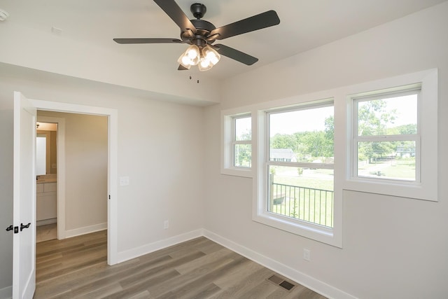 1137 Lawrence Ave Unit 1, Madison, TN 37115 - empty room featuring wood finished floors, baseboards, a ceiling fan, and a smoke detector