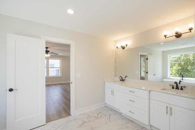 1137 Lawrence Ave Unit 1, Madison, TN 37115 - full bath with double vanity, marble look tile flooring, baseboards, recessed lighting, and a ceiling fan