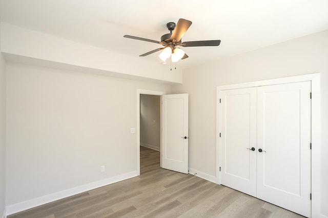1137 Lawrence Ave Unit 1, Madison, TN 37115 - unfurnished bedroom featuring light wood finished floors, baseboards, a closet, and a ceiling fan