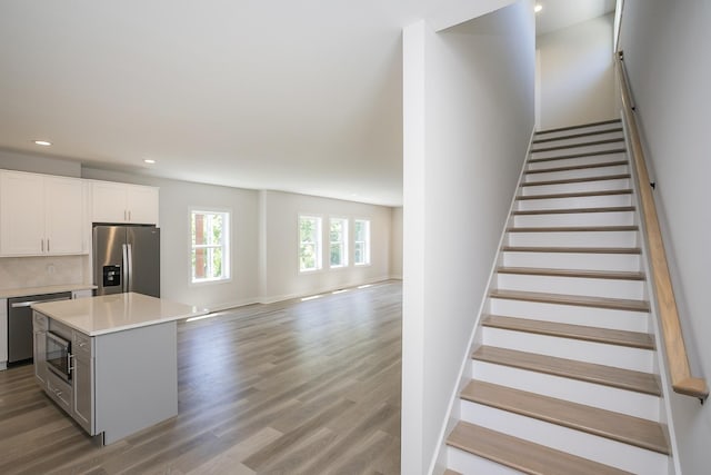 1137 Lawrence Ave Unit 1, Madison, TN 37115 - stairway featuring wood finished floors, recessed lighting, and baseboards