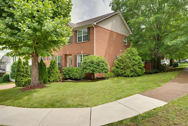 1201 Limerick Ln, Franklin, TN 37067 - view of home's exterior with a lawn and brick siding