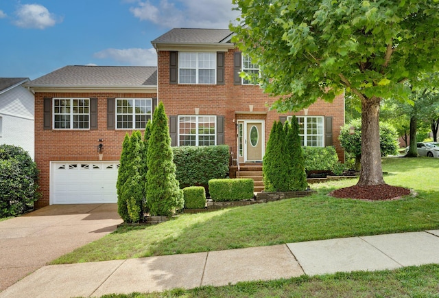1201 Limerick Ln, Franklin, TN 37067 - view of front of home featuring concrete driveway, a front lawn, an attached garage, and brick siding