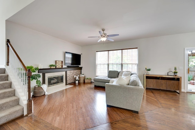 1201 Limerick Ln, Franklin, TN 37067 - living area with a high end fireplace, ceiling fan, stairway, and wood finished floors