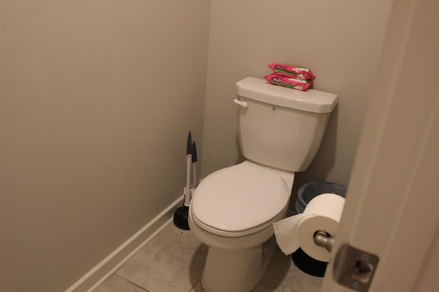 1065 Ewell Farm Cir, Spring Hill, TN 37174 - bathroom featuring toilet, baseboards, and tile patterned floors