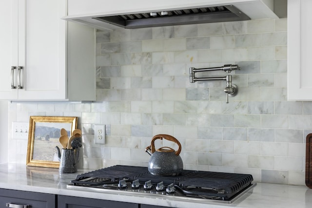 4136 Banner Square Ln, Arrington, TN 37014 - kitchen with premium range hood, stainless steel gas cooktop, white cabinetry, and decorative backsplash