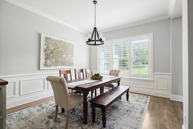 4136 Banner Square Ln, Arrington, TN 37014 - dining space with a chandelier, wood finished floors, wainscoting, crown molding, and a decorative wall