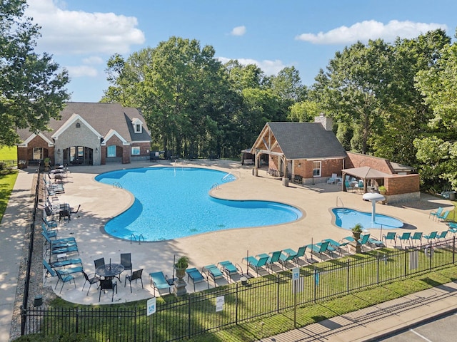 4136 Banner Square Ln, Arrington, TN 37014 - community pool featuring a patio and an outbuilding