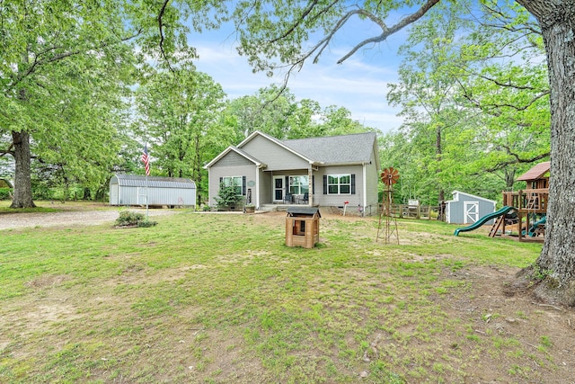 2328 C C C Rd, Dickson, TN 37055 - view of front of property featuring a front yard, a playground, and view of scattered trees