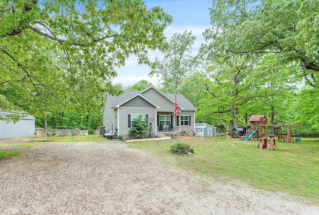 2328 C C C Rd, Dickson, TN 37055 - view of front facade featuring a playground and a front yard
