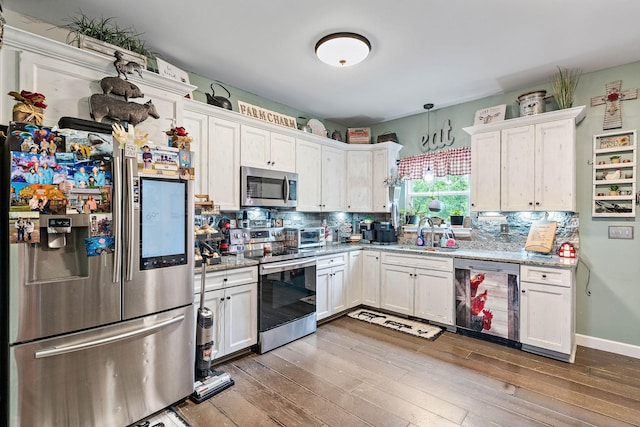 2328 C C C Rd, Dickson, TN 37055 - kitchen with stainless steel appliances, white cabinetry, and dark wood-type flooring