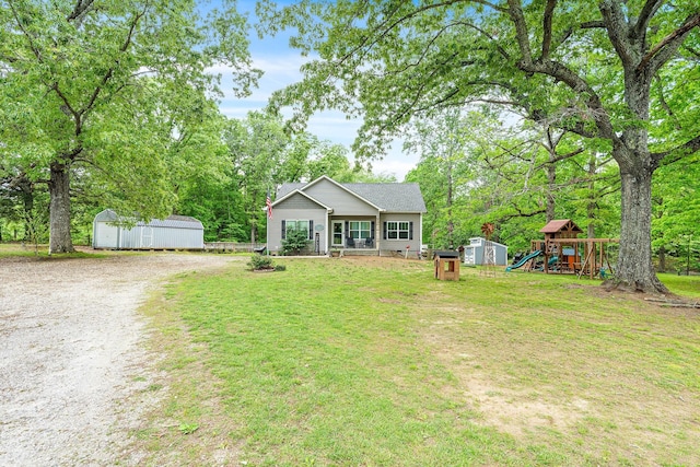 2328 C C C Rd, Dickson, TN 37055 - view of front facade with a playground, a front lawn, and gravel driveway