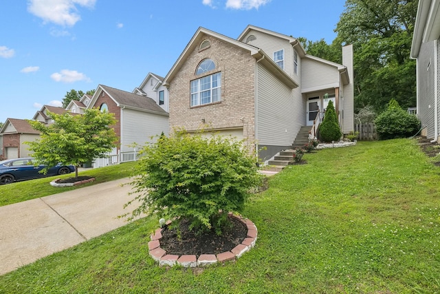 4062 Farmingham Woods Dr, Hermitage, TN 37076 - view of front facade featuring brick siding, a front yard, and a garage