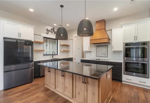 763 Thompson Creek Rd N, Shelbyville, TN 37160 - kitchen featuring appliances with stainless steel finishes, open shelves, custom range hood, a center island, and decorative backsplash