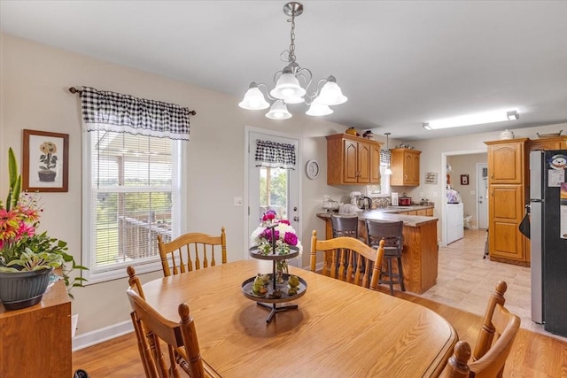 4190 Tanyard Hill Rd, Lynchburg, TN 37352 - dining area with a chandelier and healthy amount of natural light
