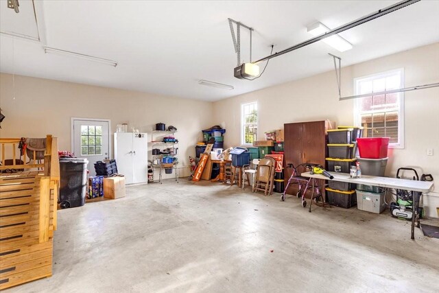 4190 Tanyard Hill Rd, Lynchburg, TN 37352 - garage with a garage door opener and freestanding refrigerator