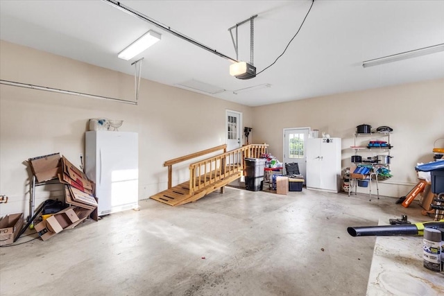 4190 Tanyard Hill Rd, Lynchburg, TN 37352 - garage featuring freestanding refrigerator and a garage door opener