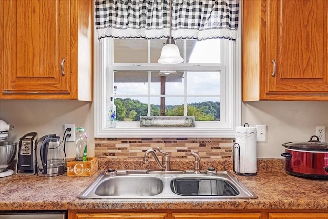 4190 Tanyard Hill Rd, Lynchburg, TN 37352 - kitchen with a sink, brown cabinetry, and light countertops