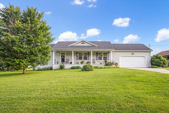 4190 Tanyard Hill Rd, Lynchburg, TN 37352 - view of front of home with covered porch, a garage, concrete driveway, and a front lawn